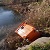 В Каменском второй раз мусорный контейнер сбрасывают в ставок